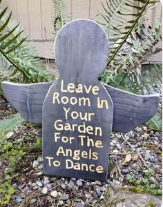 a garden sign that says leave room in your garden for the angels to dance on