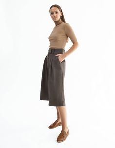 High-waisted below knee-length shorts IPANTS.A wide waistband along with front pleats highlight the waist and make it visually thinner. Bermuda shorts are made from heavy wool in soft brown color and have an extra lining to be more pleasant to the body. Shorts have comfortable side pockets and faux pockets on the back. Belt loops, zip, and hook-and-eye closures on the middle.Composition: 35% wool, 40% viscose, 20% polyester, 2% elastaneLining: 100% viscoseCare: We recommend a professional dry cl Brown Bermuda Shorts, Soft Brown Color, Body Shorts, Knee Length Shorts, Soft Brown, Wide Waistband, Unique Fashion, Brown Color, Bermuda Shorts