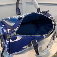 SHOP MORE LUXURY PRODUCTS HERE Description Louis Vuitton Escale Speedy BandouliÃƒÂ¯Ã‚Â¿Ã‚Â½ÃƒÂ¯Ã‚Â¿Ã‚Â½ÃƒÂ¯Ã‚Â¿Ã‚Â½ÃƒÂ¯Ã‚Â¿Ã‚Â½re 30 Monogram Canvas Blue For Women, Women’s Handbag Shoulder And Crossbody Bags 11.8in/30cm LV M45146 Tie-Dye Monogram canvas brings a beachy feel to the Speedy BandouliÃƒÂ¯Ã‚Â¿Ã‚Â½ÃƒÂ¯Ã‚Â¿Ã‚Â½ÃƒÂ¯Ã‚Â¿Ã‚Â½ÃƒÂ¯Ã‚Â¿Ã‚Â½re 30, a classic Louis Vuitton city bag relooked for the LV Escale Collection. The rolled-leather handles and distinctive shape make this bag immedi Designer Blue Satchel With Large Capacity, Luxury Large Capacity Blue Satchel, Navy Satchel Bag With Top Carry Handle, Navy Shoulder Bag With Handles, Blue Shoulder Duffle Bag For Daily Use, Designer Blue Bag With Zipper Closure, Designer Blue Satchel With Adjustable Strap, Designer Navy Bags For Daily Use, Designer Navy Bag For Everyday Use