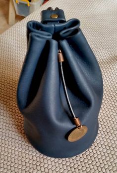 a blue purse sitting on top of a table