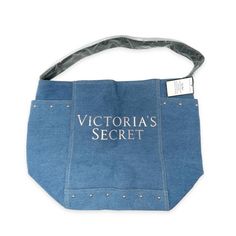 New Women's Victoria's Secret Tote Travel Beach Shoulder Bag 11140410 Denim Blue With Rose Gold Metallic Logo - Shape: Rectangle - Closure: Zip - Handle/Strap Color: Black - Occasion: Casual, Travel - Size: Large - Hardware Color: Rose Gold - Bag Depth: 8.25" - Bag Width: 19.5" - Fabric Type: Denim - Accents: Zipper - Handle Style: Shoulder Strap Large Capacity Denim Blue Bags For Summer, Denim Blue Shoulder Bag For Summer Travel, Summer Travel Denim Blue Shoulder Bag, Summer Travel Shoulder Bag In Denim Blue, Trendy Denim Canvas Bag For Travel, Trendy Denim Blue Shopping Bag, Trendy Summer Denim Bags, Blue Denim Canvas Bag With Pockets, Blue Denim Tote Canvas Bag