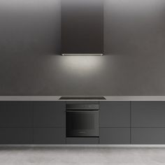 an empty kitchen with stainless steel appliances and counter tops