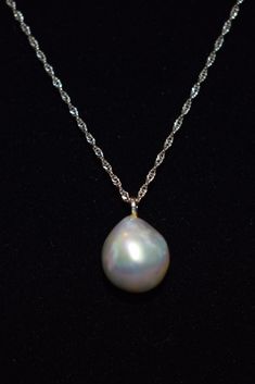 "Here is gorgeous light gray/ blue natural baroque pearl pendant necklace. The 14k white gold diamond cut chain measures 18\" and the baroque pearl is nearly 4 carats! The camera just cannot translate the absolutely beautiful iridescence of this pearl. It is full of pastel gray, blue and pink and measures 12 x 10 mm The pearl was purchased in Hawaii and has never been worn. The white gold chain has been added to allow for immediate wear." High Luster Akoya Pearl Briolette Jewelry, White Gold Pearl Pendant Necklace In Drop Shape, White Gold Tahitian Pearl Jewelry With High Luster, Formal Drop Pearl Necklace In White Gold, Formal Drop White Gold Pearl Necklace, Formal Drop-shaped White Gold Pearl Necklace, Formal Tahitian Pearl Pendant Jewelry, Silver Baroque Pearl Briolette Necklace, White Gold Briolette Pearl Pendant Necklace