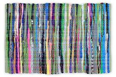 a multicolored rug with fringes on it