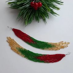 Red green gold fringe earrings Shoulder duster earrings Long | Etsy Red Bohemian Earrings For Christmas, Handmade Red Tassel Earrings For Festive Occasions, Red Tassel Earrings For Festive Occasions, Handmade Red Jewelry For New Year, Bohemian Christmas Festive Jewelry, Bohemian Christmas Dangle Earrings, Gold Tassel Earrings With Colorful Beads As Gift, Handmade Multicolor Earrings For Holiday, Bohemian Beaded Earrings For Christmas