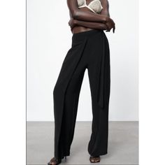 Elevate Your Everyday Style With These Black Zara Woman Trousers. Crafted From A Luxurious Satin Fabric, These Trousers Feature A Wrap Front Design With A Side Zip Closure For A Flattering Fit. The Wide-Leg Silhouette Creates A Bohemian Vibe, Making It Perfect For Travel, Casual Outings, Or Even Formal Events. With Accents Like The Logo, Flat Front Waist, And Solid Pattern, These Trousers Are Versatile And Can Be Paired With Different Tops To Create Unique Looks. They Come In Size M With A 35-In Versatile Straight Pants For Evening, Summer Wide Leg Pants For Going Out, Elegant Wide Leg Pants For Summer Date Night, Chic Straight Pants For Date Night, Elegant Summer Wide Leg Pants For Date Night, Spring Date Night High Waist Wide Leg Pants, Elegant Bottoms For Going Out In Spring, Wide-leg Pants For Evening Wear, Chic Wide Leg Pants For Going Out