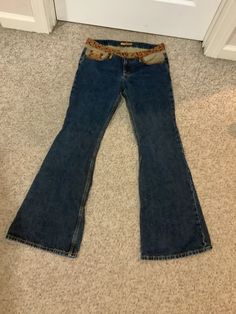 This nice pair of vintage 90s does 70s bell bottom patchwork low waist denim boho festival jeans comes to you in a marked size of 7. Pls compare the measurements I give you to those in your closet. The waistband has a cool floral detail and then gold piping on top of the pockets trim detail. Sold that way. The lower waist is approx 14 1/2 inches-rise is 8 1/2 inches-31 inches inseam-19 1/2 to 19 3/4 inches hips. Fall Festival Denim Flare Jeans, Bohemian Mid-rise Flare Jeans In Medium Wash, Bohemian Medium Wash Flare Jeans For Fall, Bohemian Flare Jeans In Medium Wash For Fall, Bohemian Flare Jeans In Denim Blue For Fall, Wide-leg Jeans For Fall Festival, Bohemian Denim Flare Jeans For Fall, Bohemian Mid-rise Cotton Flare Jeans, Wide Leg Jeans For Fall Festival