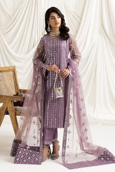 Brand: Alizeh FashionProduct Code: DUA-V02D03B-AYSAL(LILAC)Collection: Dua by Alizeh Fashion Unstitched Festive Collection Vol-02Fabric: Net PRODUCT DETAILS: Embroidered Net Front + Sleeves Embroidered Net Back Embroidered Net Dupatta Dyed Raw Silk Trouser Embroidered Trouser Patch DISCLAIMER:* Lining, Laces, and Tassels are not included in unstitched variants.* Embellishment items in stitched outfits are subject to market availability.* Product color may vary due to photographic lighting or your device settings. CARE INSTRUCTIONS: Extra Fabric Has Been Used For Shoot Original Color May Vary Slightly From The Picture Dry Clean Recommended Iron The Clothes At Moderate Temperature Do Not Use Bleach, Or Stain Removing Chamicals Damp Fabric Should Not Be Exposed To Sunlight Dua by Alizeh Fashi Pakistani Boutique, Pakistani Designer Clothes, Semi Formal Wear, Chiffon Collection, Luxury Wear, Modest Wear, Ladies Clothing, Silk Trousers, Net Dupatta