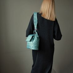 "Green mint bucket bag quilted with detachable strap. Handmade green nylon bucket shoulder bag for women. Height - 23 cm  ( 9,05 \" ) Width - 31 cm   ( 12,20 \" ) Depth - 9 cm ( 3,54 \" ) Strap  - 75 cm  ( 29,53 \" ) Green mint bucket bag made of quilted nylon fabric. Green shoulder bag has cotton lining, 1 pocket inside, detachable strap. The mint green bag fastens with 1 magnetic button. Green mini bag quilted for women. Mint mini shoulder bag quilted drawstring. Beautiful small handbag light green color. Designer green small handbag. Puffer green mint mini bag handmade. Quilted mini shoulder bag cute for woman. Mint green quilted bucket bag. Unique handmade green bucket drawstring bag. Cute mini bag green mint color." Trendy Green Quilted Shoulder Bag, Green Quilted Shoulder Bag For Travel, Quilted Green Shoulder Bag For Travel, Green Quilted Crossbody Shoulder Bag, Green Quilted Shoulder Bag, Everyday Green Quilted Bag, Green Bucket Bag With Detachable Strap For Travel, Green Quilted Tote Shoulder Bag, Mint Green Bag