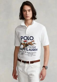 The Polo Ralph Lauren Printed Short Sleeve Polo Shirt is here to redefine your casual wardrobe. Classic fit. Ribbed polo collar. Two-button placket. Short sleeves with ribbed armbands. Graphic printed on the center-front. Tennis tail. 100% cotton. Machine washable. Imported. Classic Fitted Polo Shirt With Graphic Print, Classic White Polo Shirt, Lauren White, Knit Shirt, Polo Collar, Short Sleeve Polo, Mens Polo Shirts, Casual Wardrobe, Arm Band