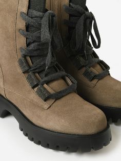 DESCRIPTION:Combat-style boot made from water-resistant suede with a lofty lugged sole.FEATURES:Lace-Up VampRound ToeInner Ankle ZipUpper: Water-Resistant SuedeRemovable Cushioned InsoleSole: RubberHeel Height: 1.75 in. Combat Style, Saint Bernard, Water Resistant, Lace Up, Boots, Lace, Water