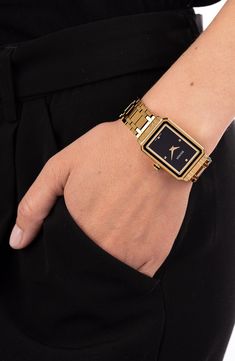 A sleek, instant classic, this deco-inspired bracelet watch features a rectangular framed case and four pyramid markers on the black dial. 25mm x  33mm case; 16mm band width Swiss quartz movement Antireflective sapphire crystal face Stainless steel with PVD Swiss made Balmain Watch, Dove Bracelet, Black And Gold Watch, Gold Watches Women, Bracelet Watches Women, Latest Watches, Black Rectangle, Gold Bracelet For Women, Women Wrist Watch