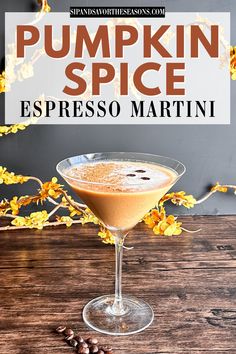 pumpkin spice espresso martini in a glass on a wooden table with coffee beans