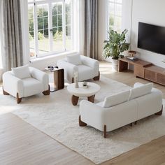 a living room filled with white furniture and a flat screen tv mounted on the wall