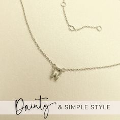 This best-selling tiny tooth necklace is the perfect Dental Hygienist gift, Dental Assistant gift, or gift for Dentist! Made with quality hypoallergenic .925 Sterling Silver, and suitable for sensitive skin. The tooth charm is dainty and delicate, and perfect to layer and stack with other necklaces. This adorable tooth charm is adorned with tiny, high quality cubic zirconia in a pavé setting, and built into the chain in a barely there, minimalist style. Necklace is adjustable, so she'll find her Dainty Hypoallergenic Initial Pendant Necklace, Dainty Adjustable Initial Necklace In Sterling Silver, Dainty Sterling Silver Initial Necklace For Everyday, Dainty Silver Initial Necklace With Adjustable Chain, Delicate Hypoallergenic Charm Necklaces, Everyday Delicate Hypoallergenic Charm Necklace, Dainty Sterling Silver Charm Necklaces, Sterling Silver Initial Necklace With Adjustable Chain For Everyday, Adjustable Sterling Silver Initial Necklace