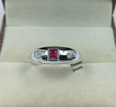 Natural Red Ruby Ring, 925 Sterling Silver, July Birthstone Ring, Men's & Women's Promise Ring, Handmade Silver Ring, Gift For Her/Him    ★ Settings ☆ Metal - 925 Sterling Silver ☆ band Color - White ⍟ The ring size shown in the pictures is 7 US. ★ Main Stone ☆ Stone - 100% Natural Ruby ☆ Size - 3×3 mm ☆ Shape - Princess cut Square ☆ Color Grade- AAA ☆ Side Stone - Round CZ Diamonds ★ Links : ☆ Check out my shop - https://www.etsy.com/shop/BiswasJewels?ref=seller-platform-mcnav ★ Notes : ☆ Don't forget to hit the favorite button in order to track the item on your favorites/wish list. ☆ Please leave your phone number at checkout for delivery purposes. Buyer Note :- The Buyer is Fully Responsible For Any Charges , Import, Custom Duties and Taxes in Buyer Country . Returns Policy We offer 100 Red Ruby Ring, July Birthstone Ring, Handmade Silver Ring, July Birthstone, Silver Rings Handmade, Red Ruby, Cz Diamond, Ruby Ring, Sterling Silver Bands