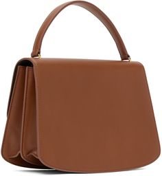 Buffed calfskin top handle bag in brown. · Fixed carry handle · Foldover flap with tab-slot closure · Zip pocket and patch pocket at two-compartment interior · H7.5 x W10 x D3.5 in Supplier color: Tawny Designer Brown Flap Bag With Top Handle, Designer Brown Top Handle Flap Bag, Modern Brown Flap Bag With Top Handle, Brown Calf Leather Satchel With Top Carry Handle, Brown Calf Leather Top Handle Satchel, Classic Brown Satchel With Round Handle, Brown Office Satchel With Round Handle, Brown Office Bag With Round Handle, Brown Flap Bag For Shopping