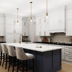 a large kitchen with white cabinets and marble counter tops, along with bar stools