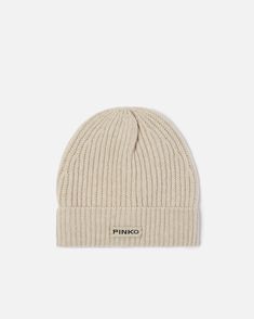 Women's cap-style hat in soft wool and cashmere knit with a distinctive warm hand. Customised with logo label. Classic Cashmere Soft Knit Hat, Classic Wool Hat With Soft Knit, Classic Wool Soft Knit Hat, Classic Cashmere Winter Hat, Classic Beige Beanie For Winter, Classic Warm Wool Hat, Classic Knitted Hats, Cozy Cashmere Soft Knit Hat, Knitted Cashmere Beanie Hat