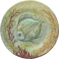 a painting of a fish on a plate with seaweed and corals around it