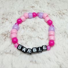 ٭⊹ UV Reactive ⊹٭  10 year old twins K & K are trying to raise money to fly from AZ to NY to see their best friend after she moved 2 years ago   ٭⊹ 🅤🅥  ⊹٭ ✿ 100% designed and handcrafted by K & K themselves ✿ Bracelet is a size:  (please see sizing chart below)  ✿ Please measure your wrist to ensure fit before purchasing. Bracelets are made with elastic bands. Again, the size provided is with the bracelet unstretched.  ⋆⋅ Size Chart ⋅⋆  Small * 16cm-19cm Med * 19cm-22cm Large * 22cm-25cm ꧁*⊹٭  TᕼᗩᑎK YOᑌ  ٭⊹*꧂ Themed Pink Bracelets For Birthday, Pink Themed Birthday Bracelets, Pink Adjustable Themed Beaded Bracelets, Pink Themed Adjustable Beaded Bracelets, Adjustable Pink Themed Beaded Bracelets, Customized Pink Novelty Jewelry, Customizable Pink Novelty Jewelry, Customizable Novelty Pink Jewelry, Customized Cute Pink Friendship Bracelets