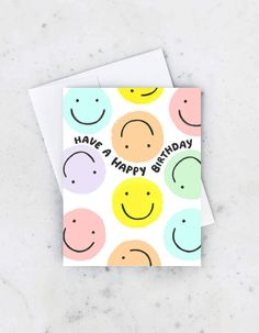 a happy birthday card with smiley faces on it