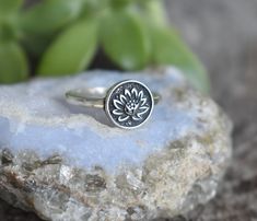 Lotus Flower Ring details:-Solid .925 sterling silver-Lotus 14mm round-Smooth ring band measures 2mm wide-Comfortable and easily stackable!- US sizes 4-12.5 with half sizes-Set of two includes Chevron Bead band 1.5mmConnect with us on Instagram @a_wild_violet for sales and giveaways!**All items are in stock and ship within 2-5 business days from received payment (excluding Saturday/Sunday) from the US. If you are within the US please expect 3-7 business days for shipping transit and delivery. In Adjustable Stackable Flower Ring, Sterling Silver Spiritual Flower Ring, Silver Hypoallergenic Flower Ring, Adjustable Hypoallergenic Flower Ring, Sterling Silver Stackable Flower Ring, Nickel-free Flower Ring For Promise, Om Ring, Lotus Flower Ring, Yoga Ring