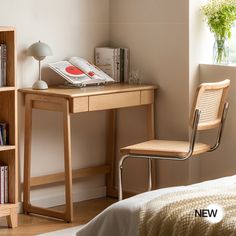 a bedroom with a desk, chair and bookcase