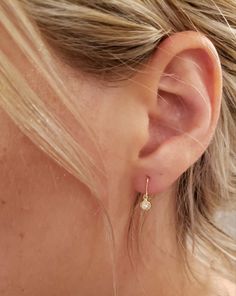 This is a beautiful diamond design earrings. It is set in real solid 14Kt Gold. You can choose if you want 14Kt White Gold, 14Kt Yellow Gold or 14Kt Rose Gold. This is the perfect gift for mom, wife, fiancee, girlfriend, valentine, daughter, family or friend. It is a special gift for mother's day, valentine's day, wedding, anniversary, birthday, Christmas, Easter, New Year's and any holiday. Setting Size: 4.05mm (0.160 inches) 0.04 Ct Total Diamond Weight Clarity: I1-I2 Color: G-H Metal Weight: Classic Huggie Earrings With Bezel Setting, Gold Dangle Diamond Earrings With Bezel Setting, White Gold Huggie Earrings With Bezel Setting, 14k Gold Bezel Set Drop Earrings, Anniversary Bezel Set Dangle Earrings, Anniversary Bezel Set Drop Earrings, Delicate Round Diamond Earrings With Single Diamond, Anniversary Dangle Earrings With Bezel Setting, Diamond Hoop Earrings With Bezel Setting As A Gift