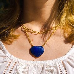 With its stunning in simplicity design and gorgeous color, this necklace represents the universal symbol of love. The faceted, domed heart of natural lapis pendant hangs from a gold filled chain. Alone or layered with your other favorites, its flirty elegance gives it a statement making vibe. Pendant: 30mm x 35mm Necklace: 16' plus an extender Layer this necklace with: https://www.etsy.com/listing/1015879146/multicolor-gemstone-beaded-necklace?ref=shop_home_active_20&frs=1&cns=1 or: http Lapis Lazuli Pendant Necklace With Gemstone Beads, Colorful Beads Lapis Lazuli Necklace Gift, Lapis Lazuli Beaded Pendant Jewelry, Lapis Lazuli Pendant Beaded Necklace For Gifts, Handmade Multicolor Lapis Lazuli Jewelry, White Coral Necklace, Lapis Pendant, Lapis Necklace, Gemstone Beaded Necklace