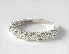 a white gold wedding band with diamonds