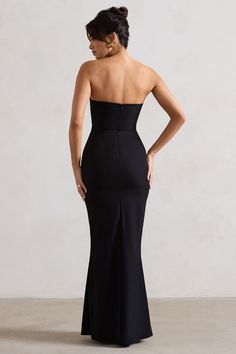 Mastering the balance between sophisticated and sultry, this black maxi dress is guaranteed to leave a lasting impression at any social gathering. Enticed boasts a boned corset bodice and supportive wired neckline thats beautifully adorned with multiple floral corsages. Pair yours with some stilettos like Oh Please for a luxurious black tie look.Features - Premium stretch crepe- Wired v neckline- Boned corset bodice- Floral corsages- Invisible zip closure- Maxi length Sizing & Fit Model is 5'8" and wears UK size 8 / US size 4Product Information Designed exclusively by Club L London Fully lined with some stretch Premium crepe in Black (87% Polyamide, 13% Elastane) 157cm total length SKU: CL132273002 Dress With Flowers, Dress Display, Club L London, Halter Neck Maxi Dress, Black Dress Prom, Black Tie Gala, Corset Bodice, Christmas Party Dress, Black Velvet Dress