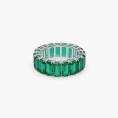 The Eden Eternity Ring Big is a true masterpiece that celebrates the impressive beauty of emeralds. Crafted from 14karat recycled gold, these exquisite rings feature a series of 6 mm lab-grown emeralds, distinguished by their vibrant green color and brilliant cut. This ring is more than just a statement piece—it radiates a vivid green from every angle, adding unparalleled elegance to any outfit. The Eden Eternity Ring Big is a symbol of luxury and sophistication, perfected through the highes The Eden, Vibrant Green, Recycled Gold, Eternity Ring, Green Color, Lab Grown, Eden, Lab Grown Diamonds, Green Colors