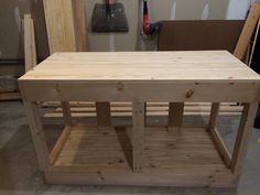 a wooden table sitting on top of a hard wood floor