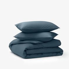 three pillows stacked on top of each other