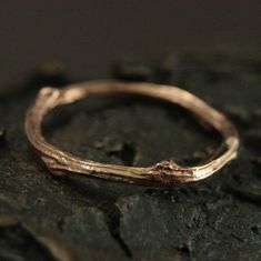 Rose Gold Twig Ring Wedding Women's Band Branch Ring Gold Nature Lover Ring Gold Tree Band Gold Bark Ring 14K Rose Twig Band Boho Twig Ring The perfect wedding ring for any nature lover, this organic shaped band is hand cast from a real twig in solid 14K gold! Sturdy, yet dainty, this band measures 1.5mm in diameter at its thinnest point and approximately 2.5mm in diameter at its widest. This makes it durable, yet comfortable. Your ring will be hand made just for you to size and either given a h Rose Gold Nature-inspired Jewelry For Anniversary, Nature-inspired Rose Gold Ring Jewelry, Gold Twig Ring, Bark Ring, Gold Twigs, 14k Gold Wedding Band, Twig Ring, Branch Ring, Gold Tree