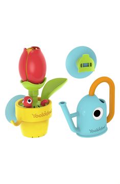 two toys that look like flowers and one has a potted plant in the shape of a watering can