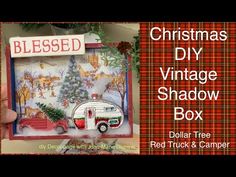 a christmas vintage shadow box with a red truck and camper in the background,