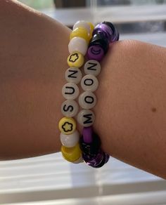 Purple and yellow bracelet set. One Sun and one Moon. Made with stretchy skin. Trendy Yellow Stretch Bracelet With Round Beads, Trendy Yellow Stretch Bracelet, Sun And Moon Clay, Sun And Moon Bracelet, Bracelet Violet, Moon Clay, Moon Made, Clay Bead Bracelet, Yellow Bracelet