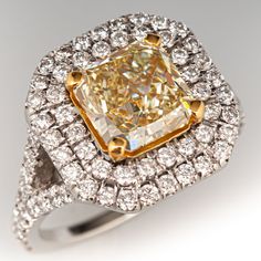 a fancy yellow diamond surrounded by white diamonds