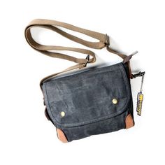 This vintage canvas bag will appeal to all men who need a comfortable and stylish bag for work or travel. Its many compartments will allow you to store all your essentials! Classic Crossbody Shoulder Bag For Outdoor, Rugged Shoulder Bag For Everyday Carry, Classic Waxed Canvas Shoulder Bag For Outdoor, Coated Canvas Saddle Bag With Adjustable Strap For Travel, Rugged Shoulder Bag For Everyday, Waxed Finish Crossbody Satchel For Travel, Classic Outdoor Crossbody Shoulder Bag, Travel Saddle Bag With Adjustable Strap In Coated Canvas, Classic Waxed Canvas Outdoor Bags