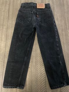 "Vintage black denim Levi's 550s child size 7 made in USA - True vintage please pay attention to measurements waist 10 1/4\"/ rise 8 1/2\" / inseam 19\" / length (waist to bottom w) 27\"/ smoke free home / no hem drag / No issues (158)" Vintage Black Jeans With Pockets, Vintage Black Jeans For Streetwear, Black Vintage Jeans For Streetwear, Vintage Black Denim Bottoms, Vintage Black Full-length Bottoms, Vintage Full-length Black Bottoms, Black Full-length Retro Jeans, Black Retro Jeans For Fall, Levi’s 550