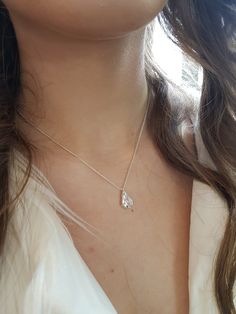 "A bridal silver necklace with a dainty CZ teardrop centerpiece. This romantic necklace features a NICKEL FREE high-quality silver-coated Swarovski teardrop crystal minimalist pendant with a silver necklace. This delicate necklace is perfect for a boho bride or bridesmaid who is looking for a stylish and classic look. You can choose your desired finish - Gold, Rose gold or Silver This necklace will compliment most kinds of brides dress tops, and can also be used on special occasions. Get this ne Delicate Drop Necklace With Cubic Zirconia, Delicate Drop Necklaces With Cubic Zirconia, Delicate Drop-shape Cubic Zirconia Necklaces, Delicate Drop Cubic Zirconia Necklace, Dainty Drop Necklace With Cubic Zirconia, Dainty Teardrop Cubic Zirconia Drop Necklace, Dainty Cubic Zirconia Teardrop Necklace, Dainty Cubic Zirconia Drop Necklace, Delicate Silver Charm Necklaces For Bridesmaids