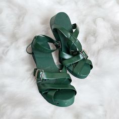 Step Into Style With These Rare Vintage Flexiclogs Women's Sandals In A Beautiful Shade Of Green. These Sandals Feature An Articulated Design With A Wood Sole And Strap, Perfect For Any Casual Occasion. The Unique Style And Material Make These Sandals A Must-Have For Any Vintage Shoe Collector. These Sandals Are Perfect For Those Who Love The Art Of Nature. The Green Color Adds A Touch Of Freshness To Any Outfit. Ideal For Those Who Love Sandals And Flip Flops, These Flexiclogs Sandals Are A Gre Green Open Heel Sandals With Rubber Sole, Green Wedge Sandals With Heel Strap And Round Toe, Green Closed Toe Sandals With Wooden Heel, Green Closed Toe Clogs With Buckle Closure, Green Open Toe Vintage Sandals, Vintage Green Open Toe Sandals, Green Vintage Open Toe Sandals, Green High Heel Sandals With Wooden Heel, Green Sandals With Wooden Open Heel