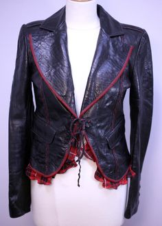 Totem handmade Italian soft leather ladies cropped black vintage jacket-circa 2000s-Size 42-US 4/6-UK 8/10-EU 36/38-Weight 785g-Free postage The jacket is made of soft Italian leather with a lining made of acetate and viscose and was made in Italy The jacket is used but overall is in excellent condition with a red tartan lining and fringe detail (see pictures) The jacket has leather ties for closure and have the following approximate measurements: Overall length (edge to edge): 45cm (from behind Edgy Fitted Leather Jacket For Alternative Fashion, Fitted Edgy Leather Jacket For Alternative Fashion, Fitted Leather Jacket For Alternative Fashion, Fitted Gothic Leather Jacket, Black Fitted Leather Jacket For Alternative Fashion, Fitted Black Leather Jacket For Alternative Fashion, Fitted Leather Jacket For Stylish Wear, Fitted Punk Leather Jacket For Alternative Fashion, Leather Fitted Jacket For Party