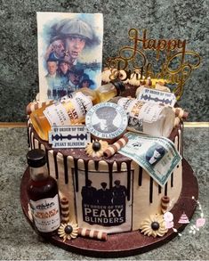 a birthday cake decorated with liquor and other items