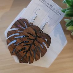 ". This handmade pair is crafted from Wood and extremely lightweight. ❤️ Wooden pendant cut to resemble the beautifully antique leaves of the Monstera plant   The listing picture shows the Walnut   2.25 earring hang 2.5\" Stainless Steel hooks are Standard and come with plastic clear backing Additional options available at checkout This Trendy Leaf design is ready to gift to a friend or purchase for yourself!   Additional Options available at checkout Wood size: Medium 1.75 LARGE2.25,ex Large 2.75 Add about .5 for hanging  Need a different size? Add it to the note to seller section when ordering :) *Earring Hooks Ear Wires with Ball and Coil Hypo-Allergenic Material: Alloy, high-quality nickel-free & lead-free, safe and durable Size: about 18mm long, 0.8mm thick, hole about 2mm  Perfect fo Leaf-shaped Brown Earrings Gift, Brown Leaf-shaped Earrings Gift, Brown Leaf-shaped Jewelry For Gift, Brown Leaf-shaped Earrings For Gift, Unique Leaf-shaped Earrings For Gift, Adjustable Leaf-shaped Earrings For Gift, Adjustable Leaf Shape Earrings For Gift, Monstera Earrings, Wood Earring