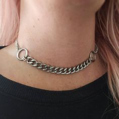 Super trendy punk style chunky chain choker necklace in silver! Thick curb chain and O ring choker necklace. Chunky yet lightweight and super comfortable to wear! Made of stainless steel so will not tarnish or discolour. Available in 2 sizes: Small: ( shown in photographs) measures 12.5 inches and comes with a 3 inch extension chain  Medium: Measures 14.5 inches and comes with a 3 inch extension chain  Please note this necklace is best worn as a tight fit. Please don't hesitate to contact me with any queries or suggestions ☺️ 💕 You will receive this necklace gift wrapped ready to give as a gift to someone special or as a special treat for yourself! 💕 Chunky Chain Stainless Steel Jewelry For Streetwear, Trendy Adjustable Chain Jewelry For Streetwear, Punk Style Stainless Steel Clavicle Chain Jewelry, Punk Stainless Steel Clavicle Chain Jewelry, Trendy Metal Choker With Silver Chain, Edgy Metal Jewelry With Chunky Chain, Trendy Metal Choker Chain Necklace, Trendy Metal Necklaces With Curb Chain, Trendy Metal Jewelry For Streetwear