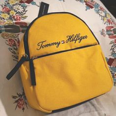 Tommy Hilfiger Yolk Yellow Mini Backpack Brand New With Tags Yolk Yellow Canvass With Navy Blue Accents Traditional Tommy Branding Size 9w X 11h X 4d Yellow Back To School Bag With Zipper Closure, Trendy Yellow School Backpack, Casual Yellow Bags With Zipper Closure, Trendy Yellow Backpack Shoulder Bag, Trendy Yellow Backpack-style Shoulder Bag, Trendy Yellow Backpack Bag, Trendy Yellow Backpack Style Shoulder Bag, Yellow Shoulder Bag For Back To School, Back To School Yellow Shoulder Bag