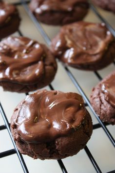 chocolate cookies with peanut butter frosting sitting on a cooling rack, ready to be eaten